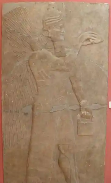 Relief slab from a wall, winged man - standing genie
